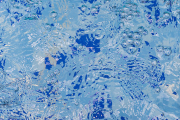 Clear and clean water in the blue swimming pool
