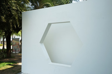 Design of Hexagonal window frame on white wall shade