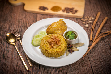 Delicious spicy chicken biryani on rustic wooden background, Chicken Biryani Thai style