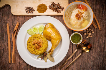 Delicious spicy chicken biryani on rustic wooden background, Chicken Biryani Thai style