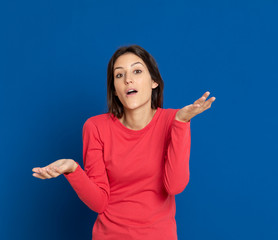 Fototapeta premium Brunette young woman wearing a red T-shirt
