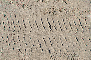 Tyre (tire) track on yellow sand