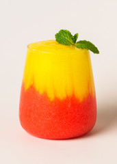 Layered mango and strawberry smoothie