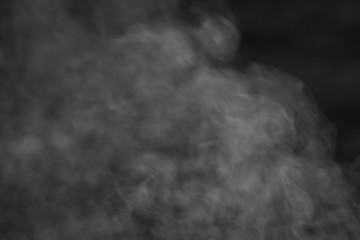Fog or smoke on a dark background closeup, abstract background