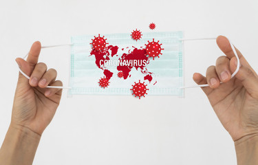 A woman holding a face mask. Surgical mask protects against the spread of Coronavirus.