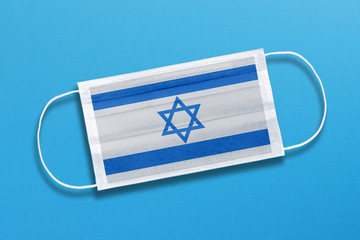 Medical mask, surgical face mask with israel flag on blue background