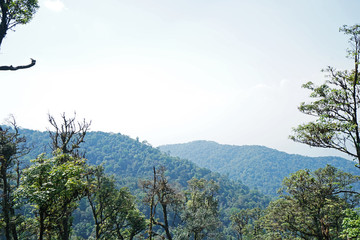 Natural landscape of green mountain range with cloudy blue sky