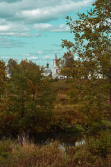 old Orthodox Church on the river Bank in the forest