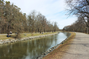 Fototapeta na wymiar canal in spring with cloudy sky