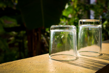 Outdoor Tea pouring into glass cup transparent with day sunlight.
