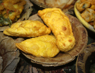 gujiya,sweet,deep fried dumpling served in disposable plate