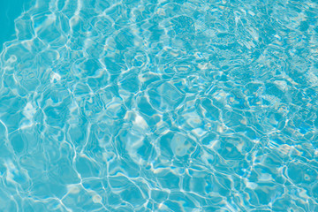Blue water ripple reflection in the swimming pool