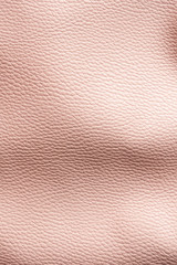 Pink wrinkled leather texture. Elegant background