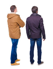 Back view of couple in winter jacket.