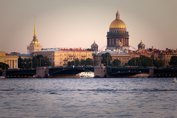 Fototapeta premium St. Petersburg, Russia - View of St. Isaac's Cathedral on a summer evening Admiralty building from the Neva. Summer sunset in Petersburg