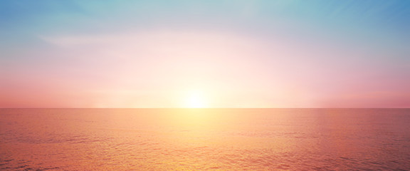 Fototapeta premium Blur pastels gradient sunset background on soft nature sunrise peaceful morning beach outdoor. heavenly mind view at a resort deck touching sunshine, sky summer clouds.