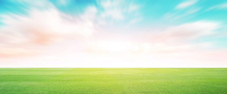 Football green field with cloud blue sky background. Landscape outdoor sport.