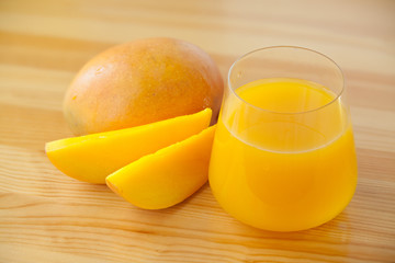 Delicious fresh squeezed mango juice in  transparent glass