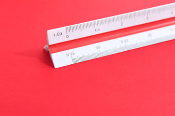 Triangular scale on red surface. Scale 1:50.
