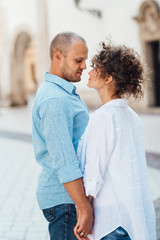 Fototapeta premium guy and a girl happily walk in the morning on the empty streets