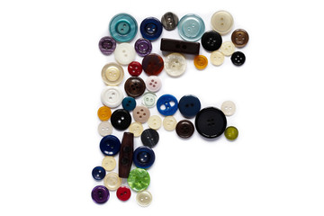 Letter F design made from clothing elements.