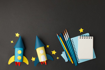 Creative education background. Back to school concept. rocket cut from paper toilet roll tube and...