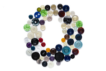 Letter O design made from clothing elements.