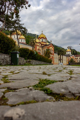 Fototapeta premium Abkhazia, New Athos. View of the monastery with golden domes