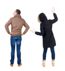 Back view of couple in winter jacket.