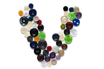 Letter V design made from clothing elements.