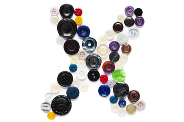 Letter X design made from clothing elements.