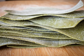 Fresh pasta lasagne homemade with flour eggs and spinaches