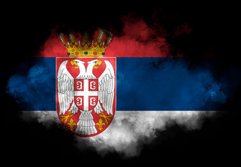 Serbia flag performed from color smoke on the black background. Abstract symbol. - obrazy, fototapety, plakaty