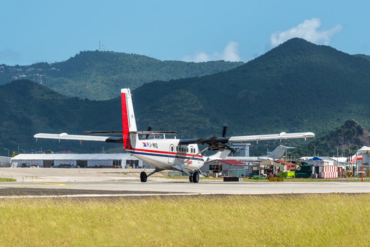 St. Maarten, Netherlands - December 17, 2018: The De Havilland Canada DHC-6-300 Twin Otter airplane preparing for takeoff at Princess Juliana International Airport in Sint Maarten - Saint Martin.