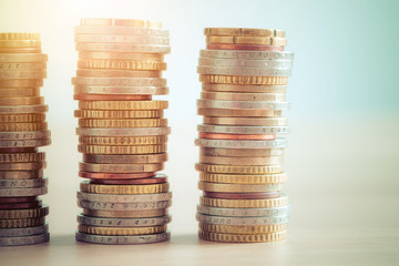 Money concept: Coins tacked on each other. Inflation, currency, savings, money