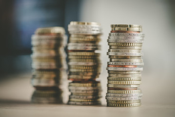 Market crisis and financial aid concept: Coins tacked on each other. Inflation, currency, savings,...