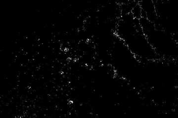 Splashes and drops of water are on a black background.