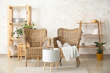 Interior of modern room with wicker armchairs
