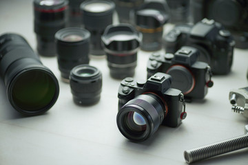 close up photo of tools of trade, professional camera and lens