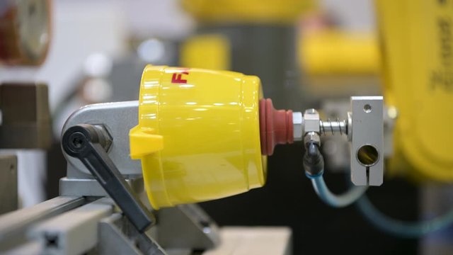 Automatic pad printing machine. Drawing an inscription on a plastic cup