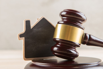 Real estate sale auction concept - gavel and house model