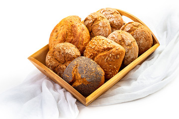 Bread rolls on a wooden tray. Isolate on white background