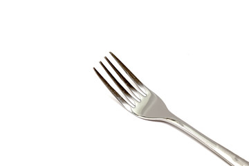 Steel fork close-up on a white background