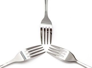 Steel fork close-up on a white background