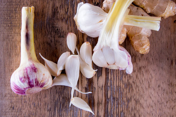 garlic, green, young, ginger on a wooden background