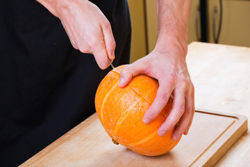 Cut pumpkin in kitchen