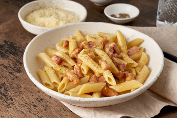 Carbonara pasta. Penne with pancetta, egg, parmesan cheese and cream sauce.