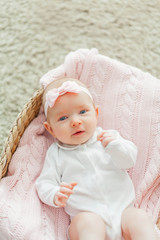 Fototapeta na wymiar Little cute girl of 2 months. Newborn.