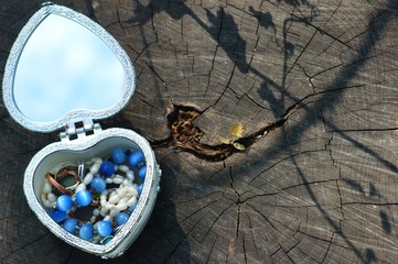 Jewelry box on a wooden surface.