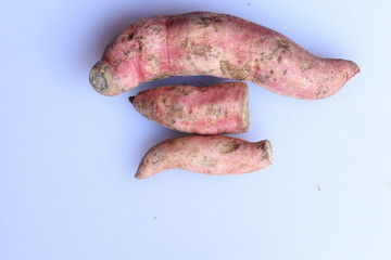 Fresh sweet potatoes isolated on white background